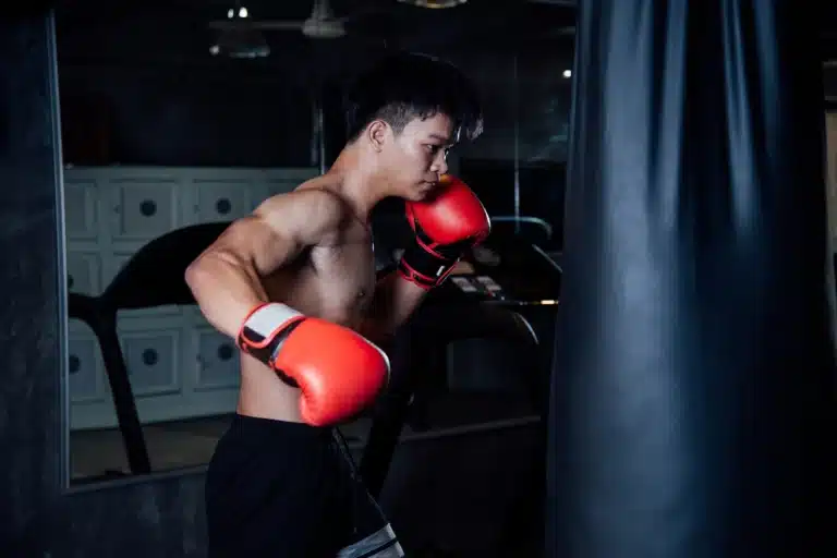 young man strong sports man boxer make exercises gym healthy concept ()